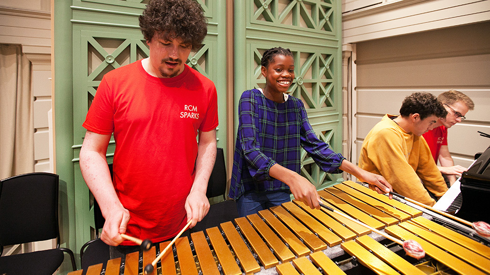 RCM students and Sparks participants playing marimba and piano RCM students and Sparks participants playing marimba and piano
