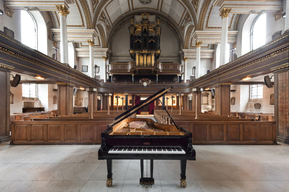 A piano inside the stone hall of St James's Piccadilly