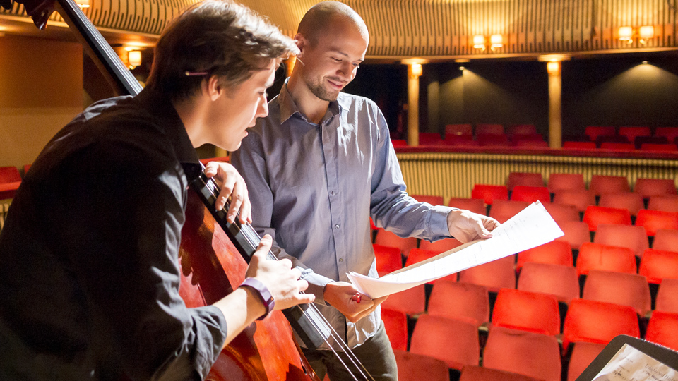An RCM composer working with a double bassist in the Britten Theatre An RCM composer working with a double bassist in the Britten Theatre