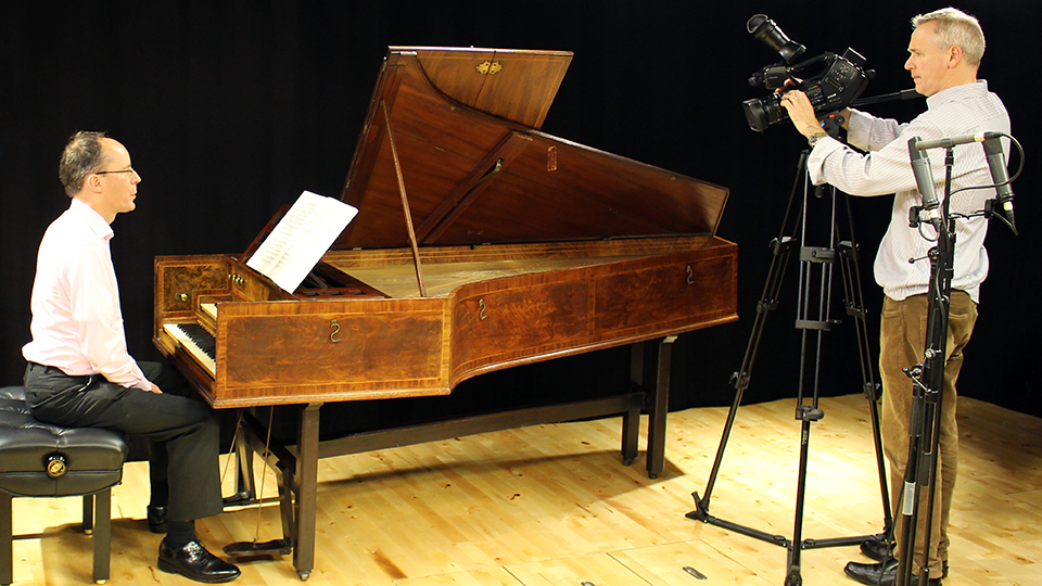 Terence Charlston being filmed playing the harpsichord Terence Charlston being filmed playing the harpsichord